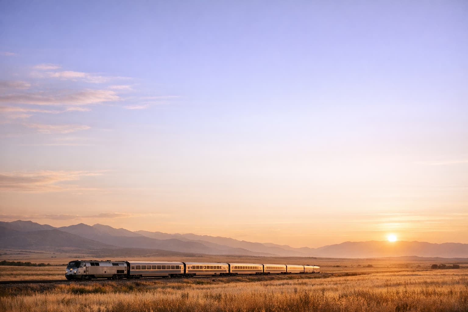 Premium train journey scene at golden hour with calm open landscape.